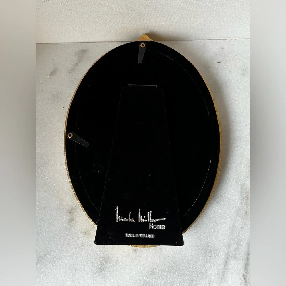 Nicole Miller elegant oval